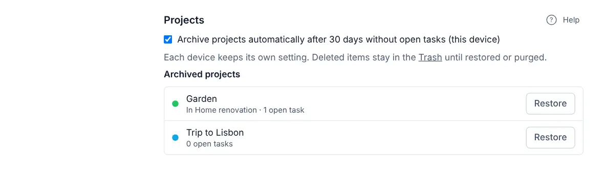 Settings, Projects section: the automatic archiving option and an Archived projects list with two projects, each with a Restore button.